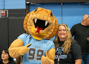 Cactus principal poses with Cobra mascot